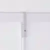 A white lock-on rod sleeve at the top of a white rod hanging on a gallery system.
